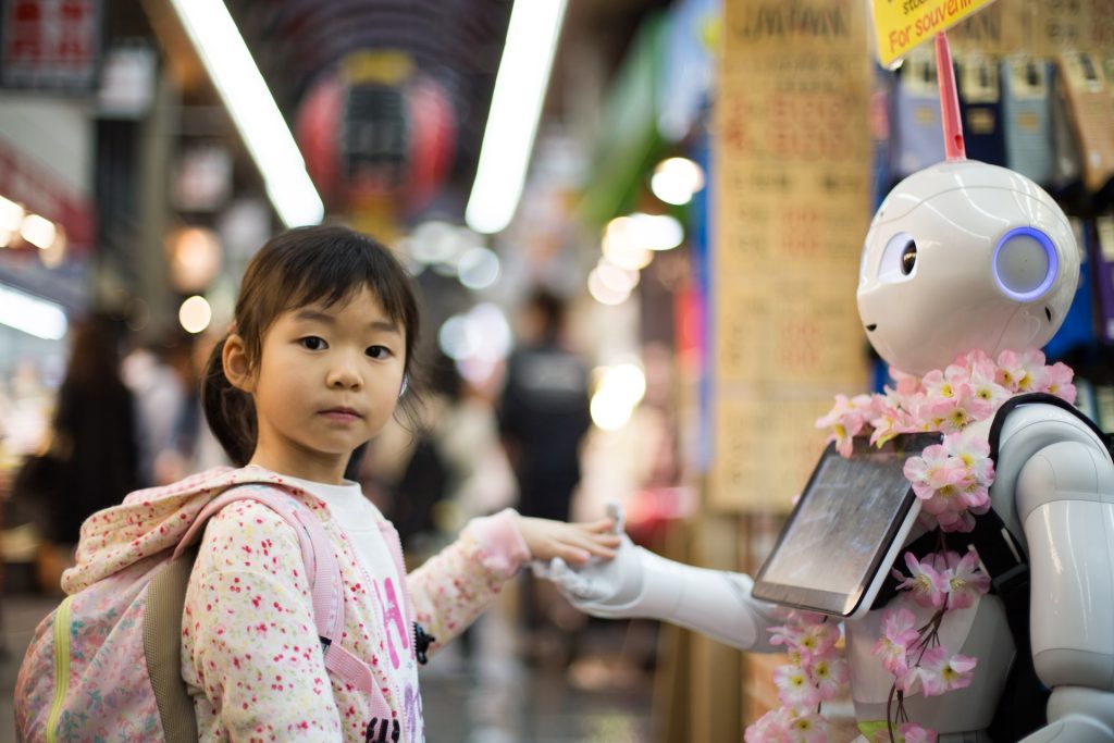girl touching a robot