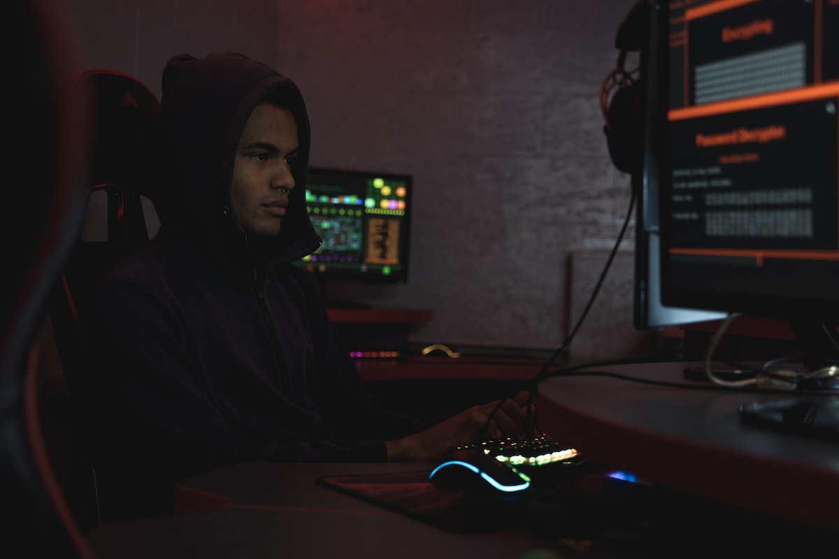 Man in Black Hoodie Using a Computer