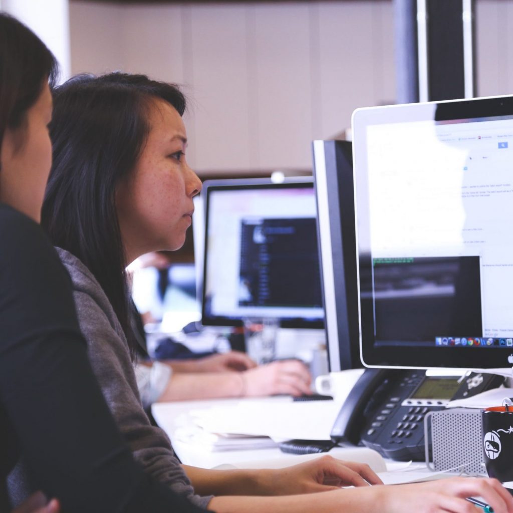 two women using a computer